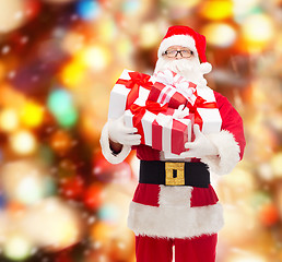 Image showing man in costume of santa claus with gift boxes