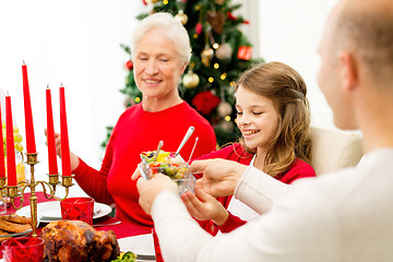 Image showing smiling family having holiday dinner at home