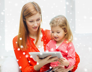 Image showing happy mother and daughter with tablet pc computer