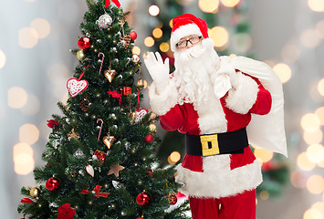 Image showing santa claus with bag and christmas tree