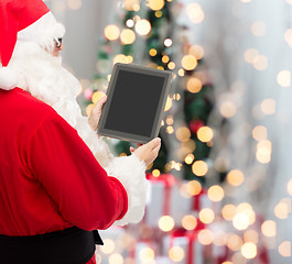 Image showing man in costume of santa claus with tablet pc