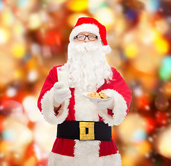 Image showing santa claus with glass of milk and cookies