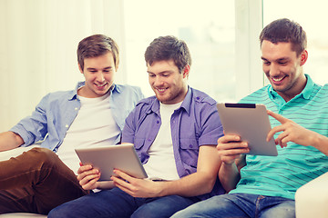 Image showing smiling friends with tablet pc computers at home