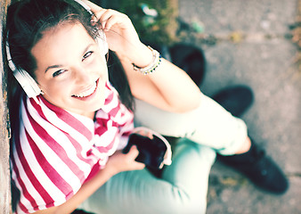 Image showing girl with headphones listening to music