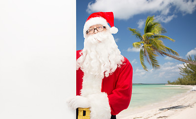 Image showing man in costume of santa claus with billboard