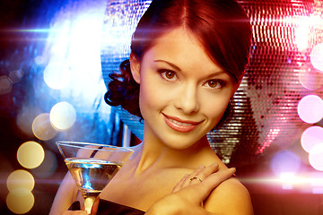 Image showing woman with cocktail and disco ball