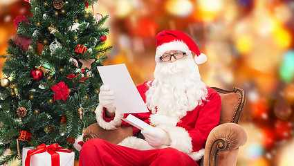 Image showing man in costume of santa claus with letter