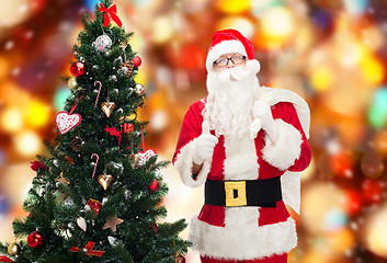 Image showing santa claus with bag and christmas tree