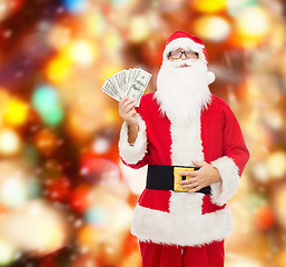 Image showing man in costume of santa claus with dollar money