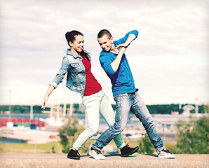 Image showing couple of teenagers dancing outside