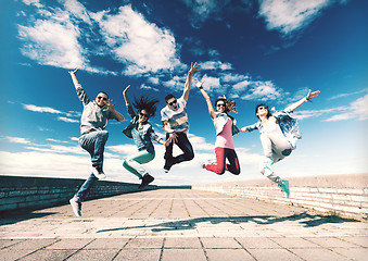 Image showing group of teenagers jumping