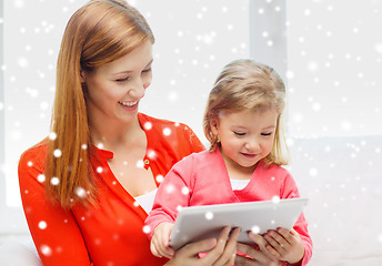 Image showing happy mother and daughter with tablet pc computer