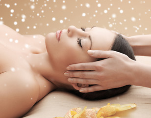 Image showing beautiful woman getting face or head massage