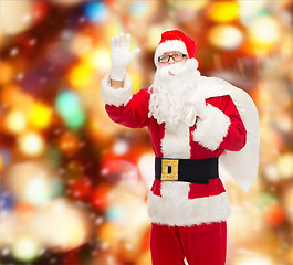 Image showing man in costume of santa claus with bag