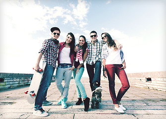 Image showing teenagers with skates outside