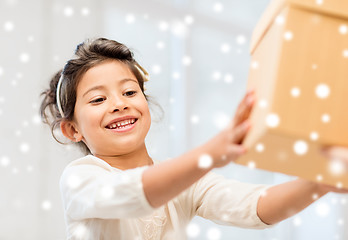 Image showing smiling little girl with gift box