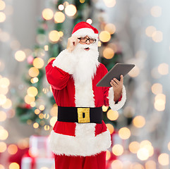 Image showing man in costume of santa claus with tablet pc