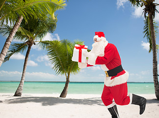 Image showing man in costume of santa claus with gift box