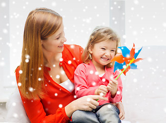 Image showing mother and daughter with pinwheel