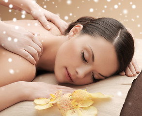 Image showing beautiful young woman in spa salon getting massage