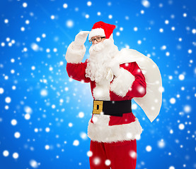 Image showing man in costume of santa claus with bag