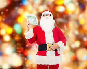 Image showing man in costume of santa claus with euro money