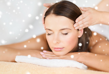 Image showing beautiful woman getting face or head massage