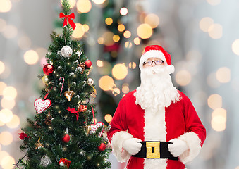 Image showing man in costume of santa claus with christmas tree