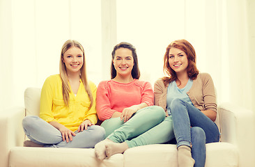 Image showing three girlfriends having a talk at home