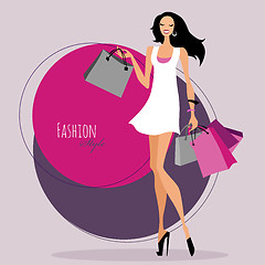 Image showing Fashion girl. Woman with shopping bags.