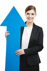 Image showing Business woman holding a blue arrow