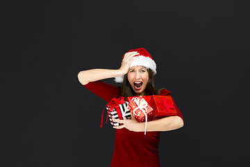 Image showing Woman holding christmas gifts