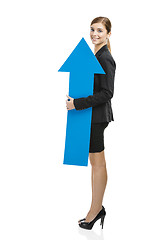 Image showing Business woman holding a blue arrow