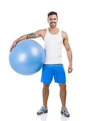 Image showing Athletic man with a pillates ball