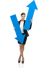 Image showing Business woman holding blue arrows