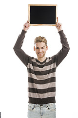 Image showing Man holding a chalkboard