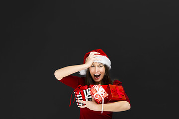 Image showing Beautiful woman holding christmas gifts