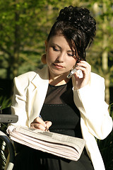 Image showing Woman at cafe doing business