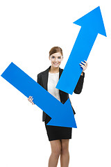 Image showing Business woman holding blue arrows