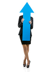 Image showing Business woman holding a blue arrow