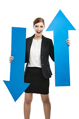 Image showing Business woman holding blue arrows