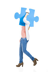 Image showing Woman holding a puzzle