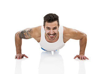 Image showing Athletic man making pushups