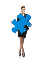 Image showing Businesswoman with a puzzle piece