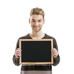 Image showing Man holding a chalkboard