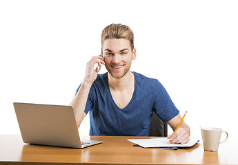 Image showing Young man and talking at phone