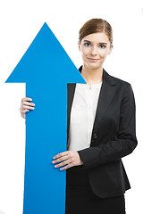 Image showing Business woman holding a blue arrow