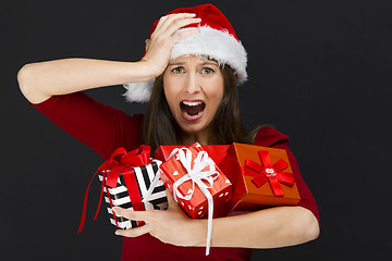 Image showing Woman holding christmas gifts