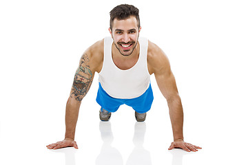 Image showing Athletic man making pushups