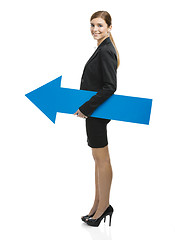 Image showing Business woman holding a blue arrow